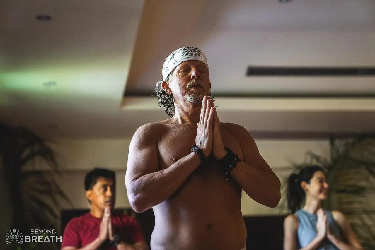 Hands resting on chest and belly during a breathing practice